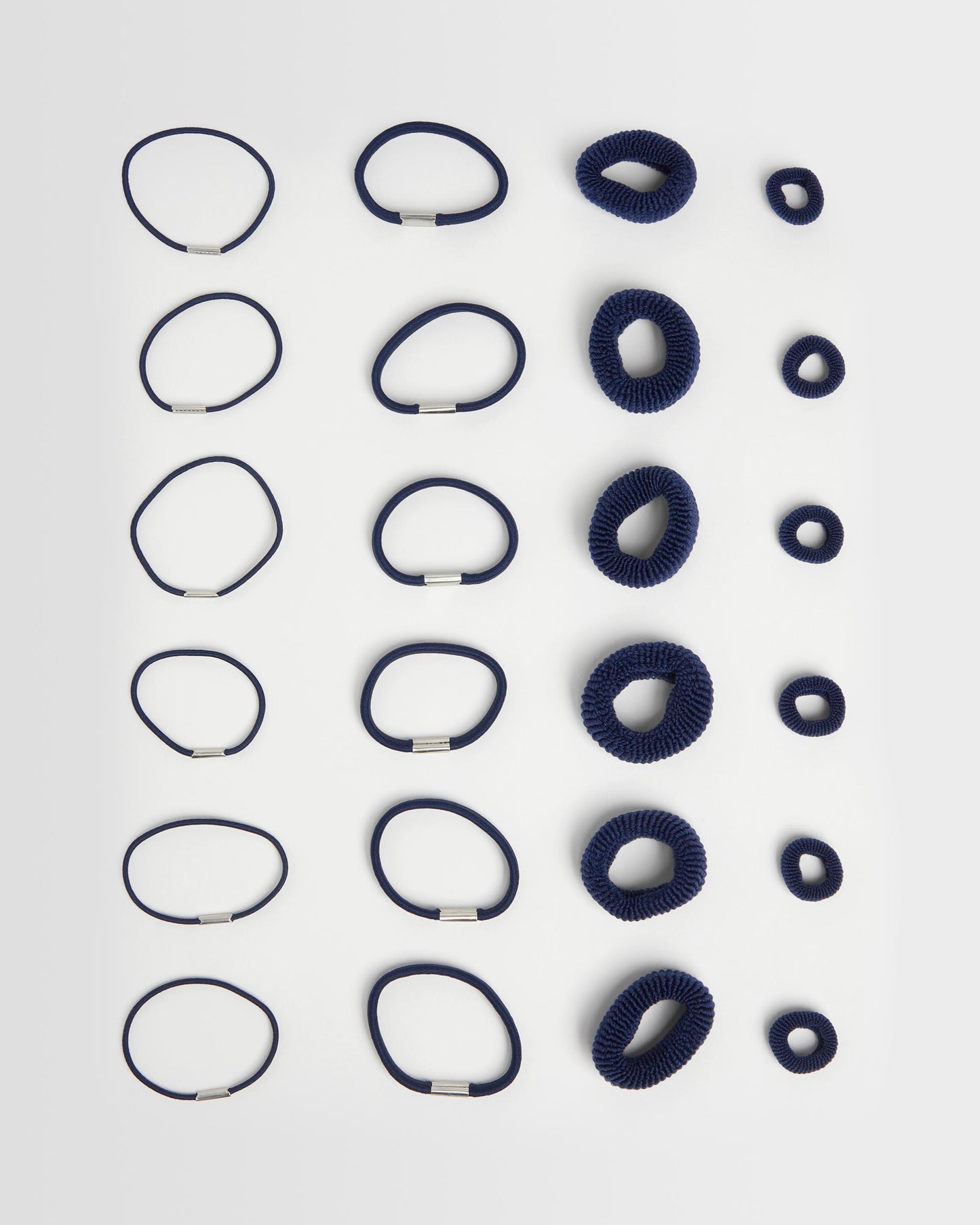 navy hair ties full amount (24) on a light grey background