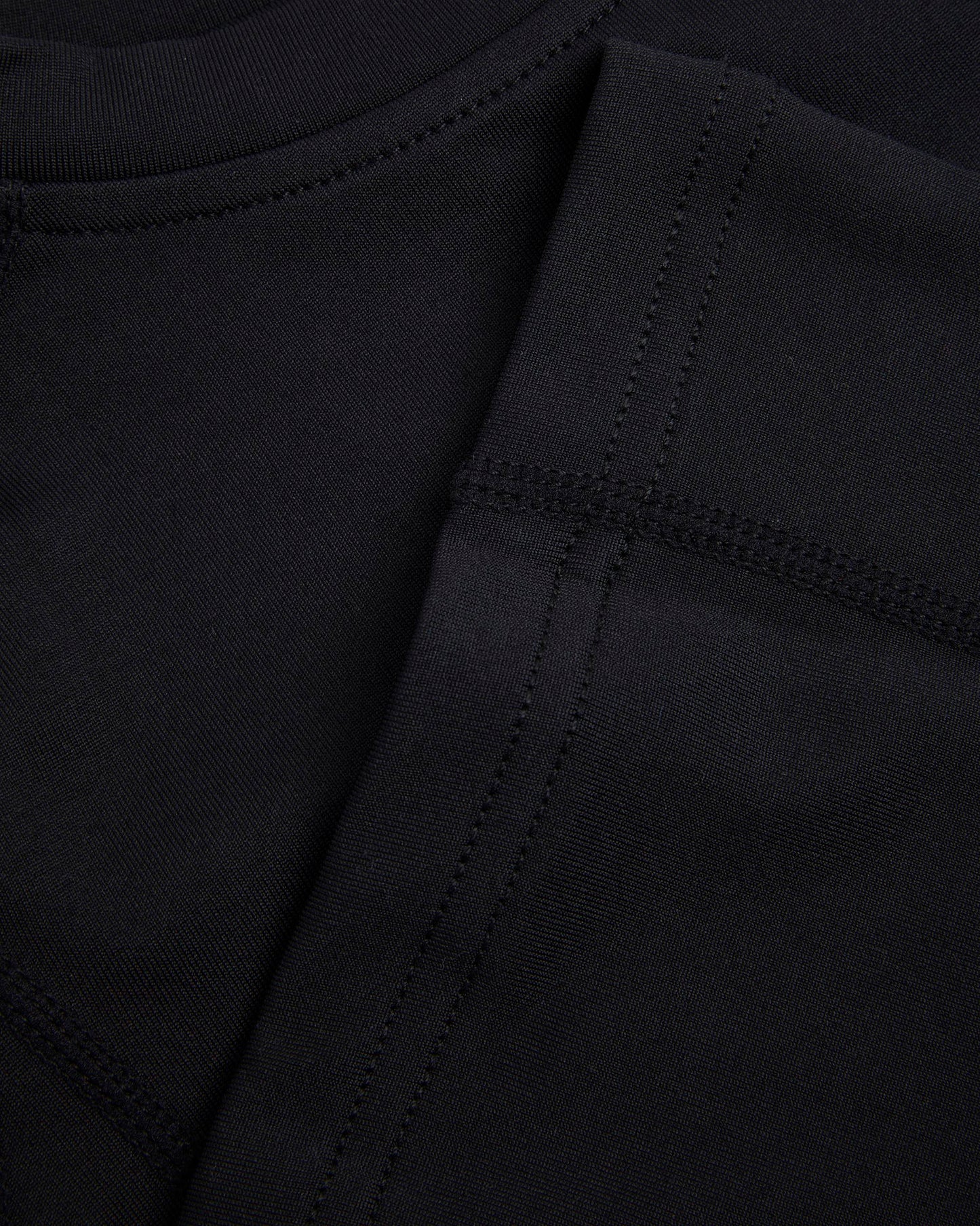 Close up of hem and seams of a black baselayer