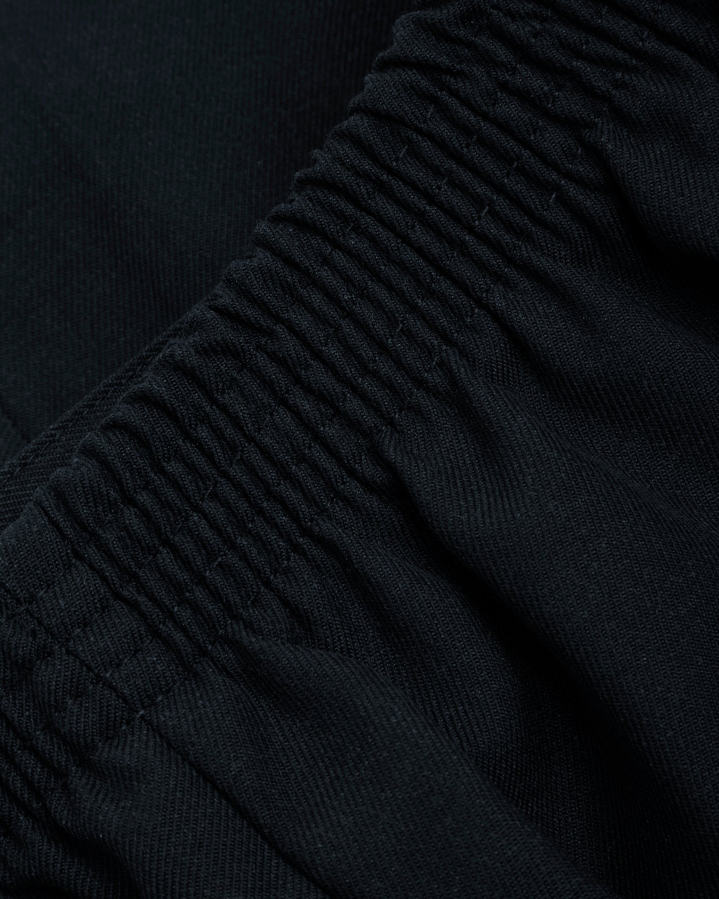 Close up of waitsband eclastic of boys navy summer shorts
