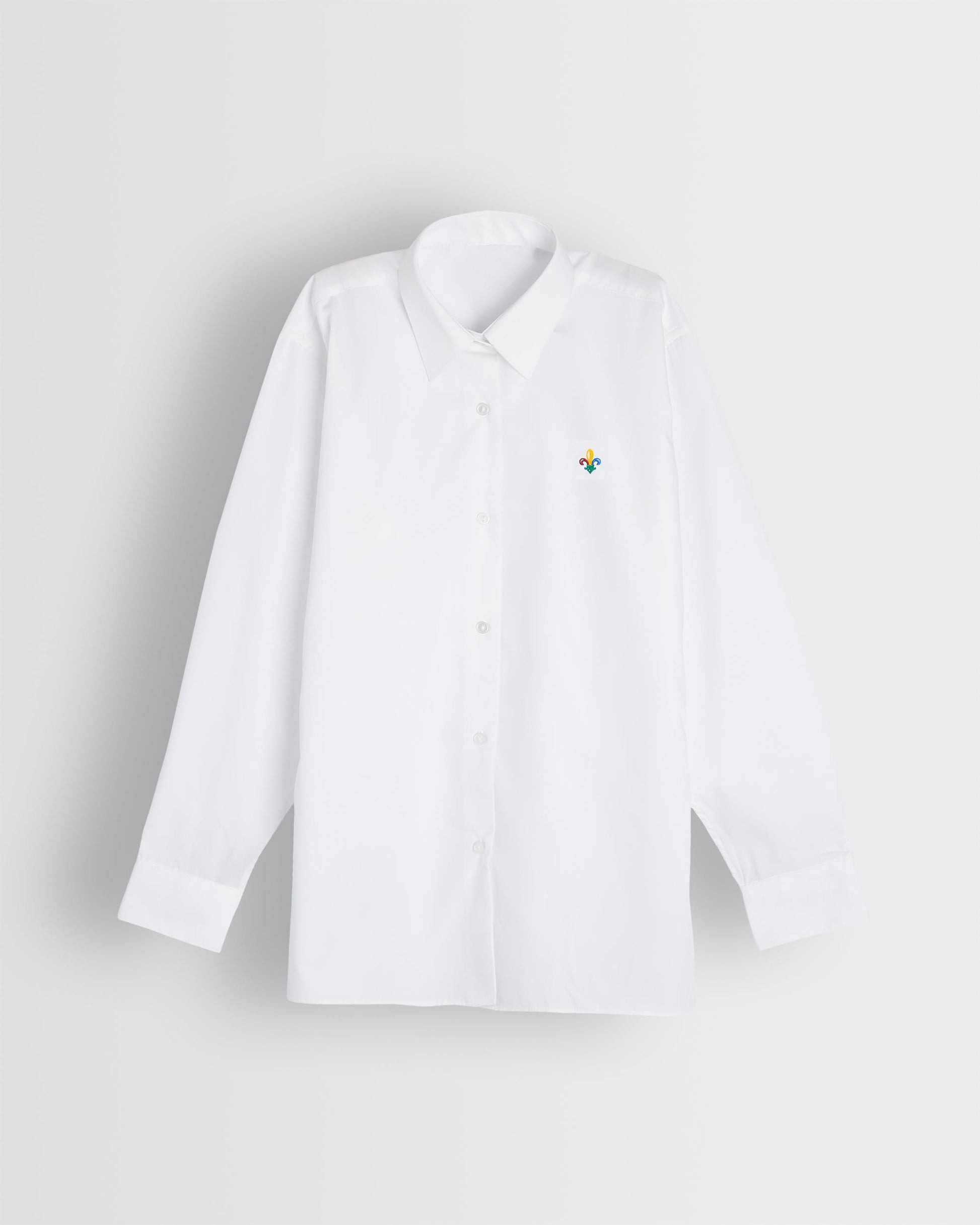 A long sleeve white blouse with a collar, with school logo embroidered on left chest, displayed against a plain background.