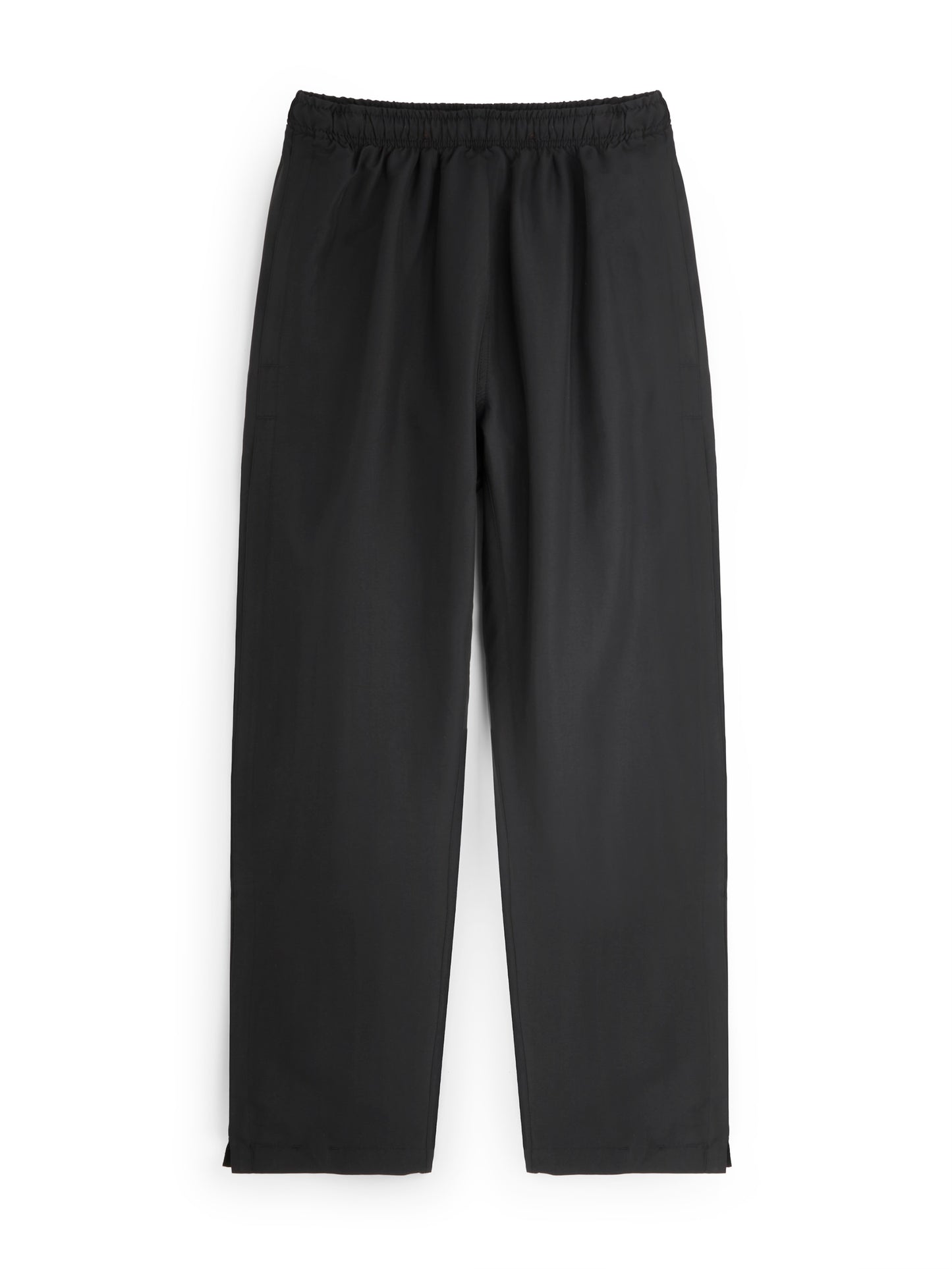 Black track pants on a white background