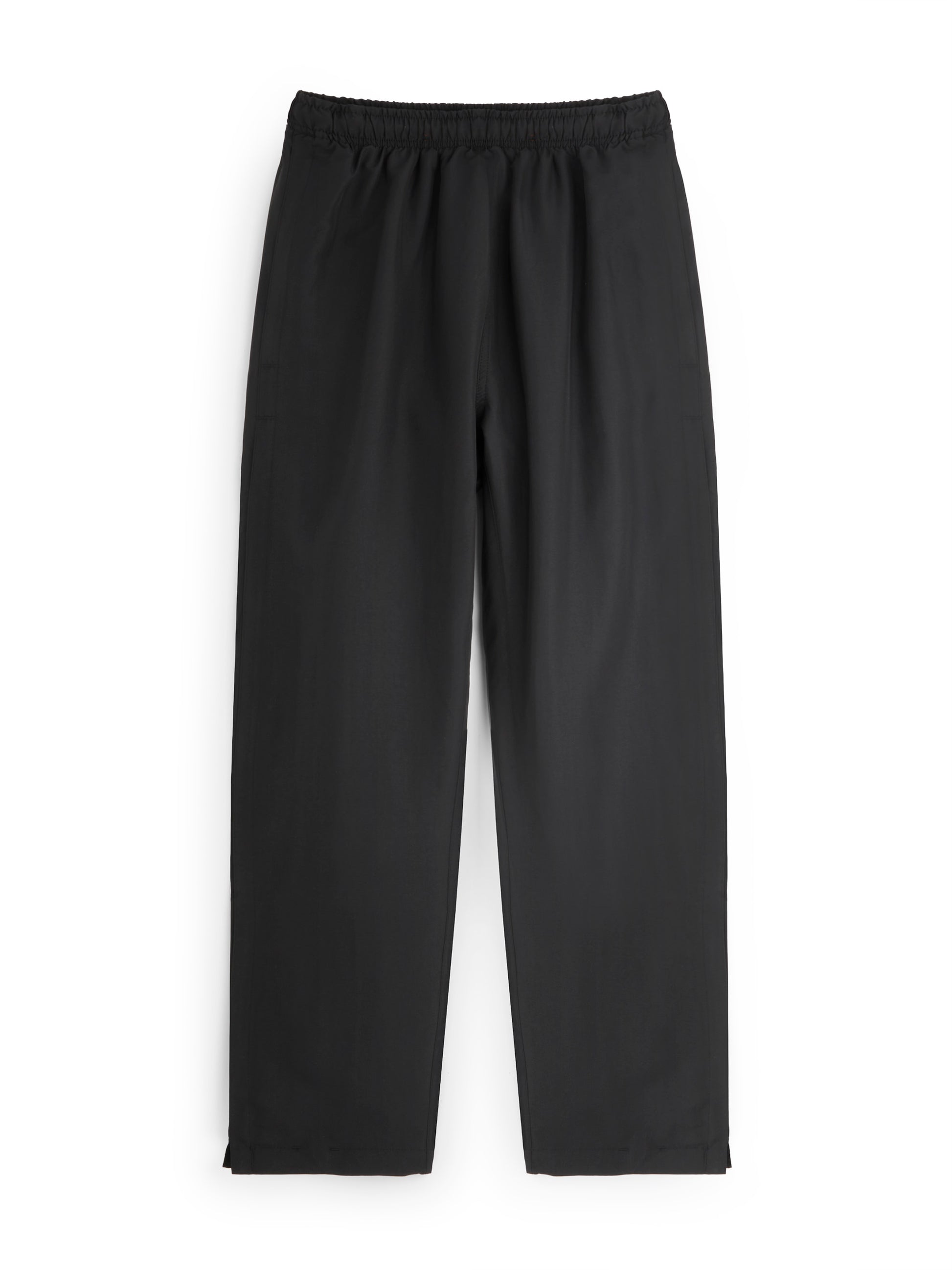 Black track pants on a white background
