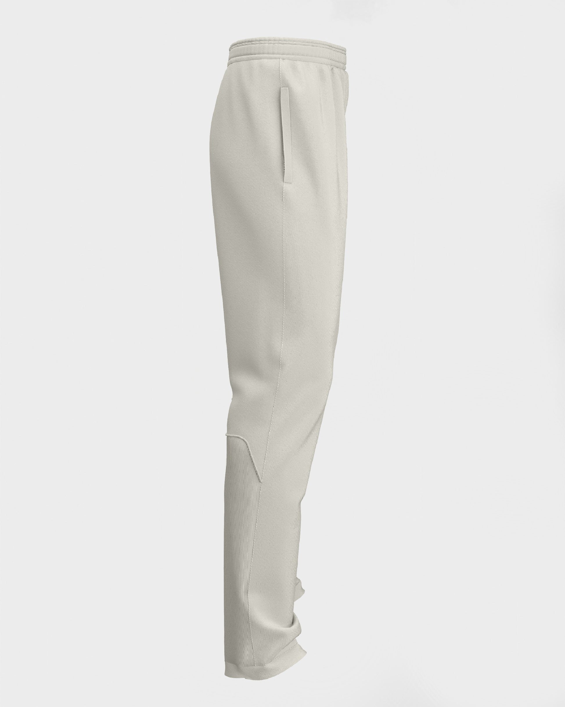 Side view of pair of white cricket trousers for kids, displaying a straight-leg design with a drawstring waistband.