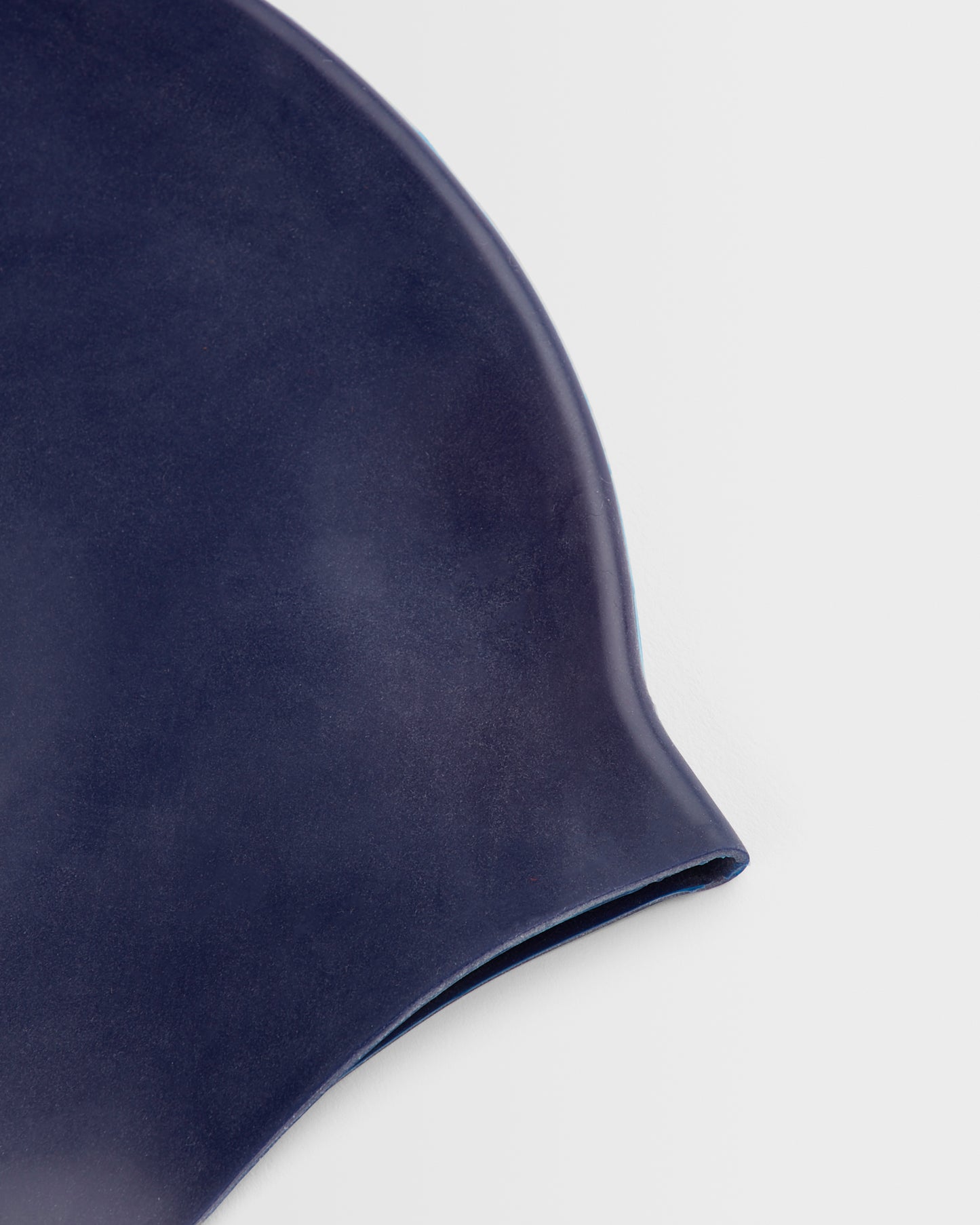 Close up of a navy swim cap