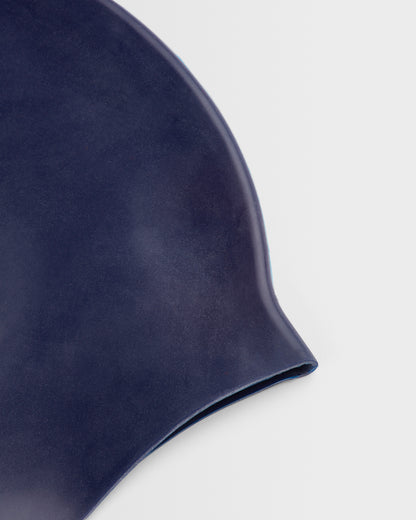 Close up of a navy swim cap