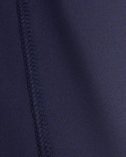 Close-up of a navy blue fabric with stitching detail