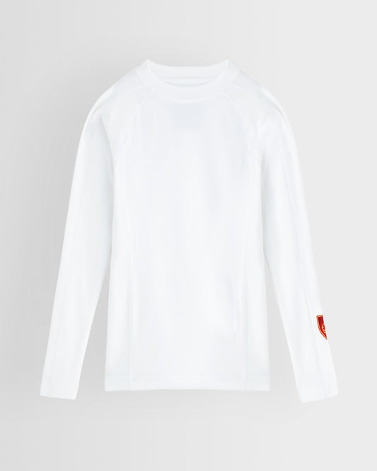 A white long-sleeve crewneck baselayer with a small red shield logo on the left sleeve, displayed on a light grey background.