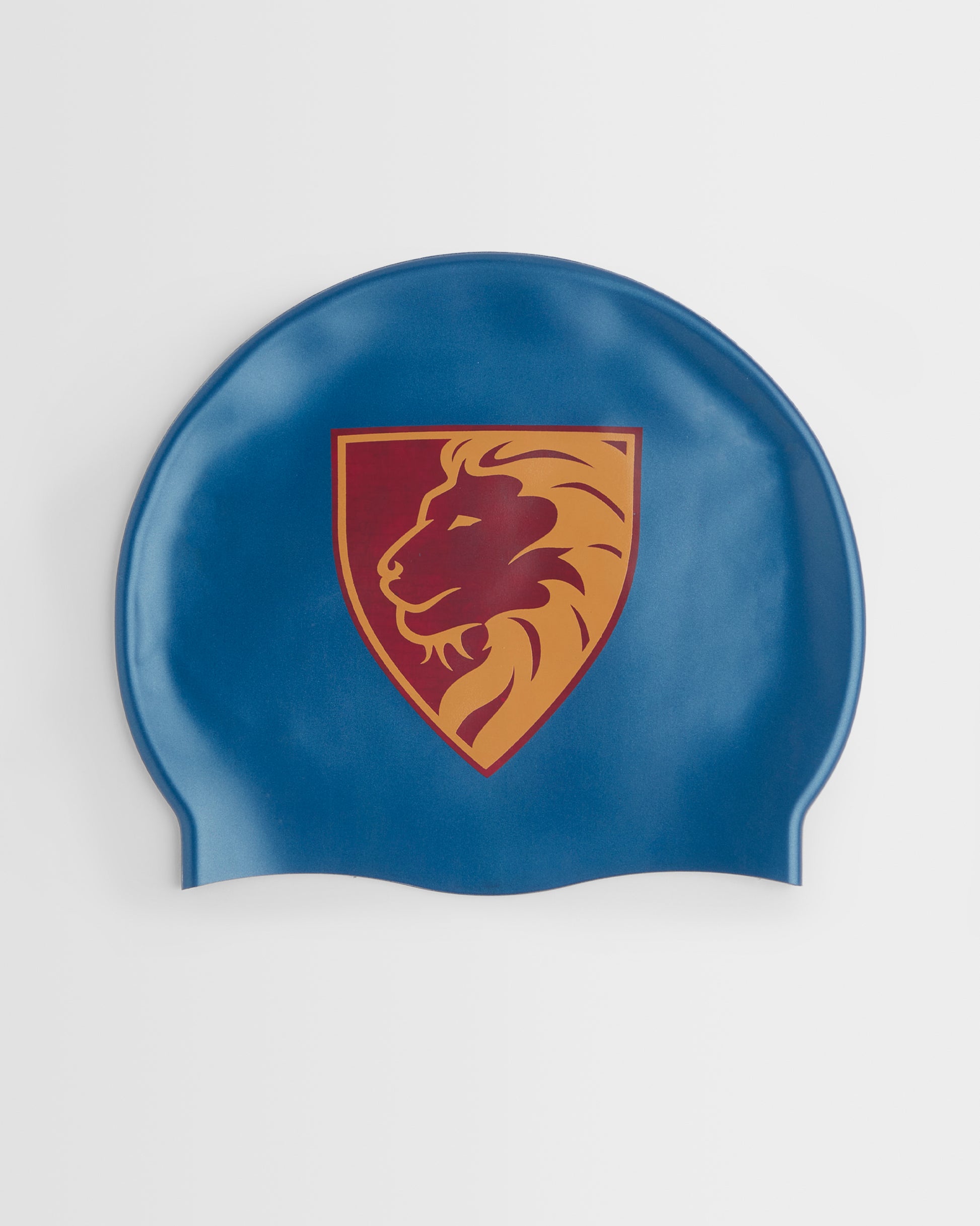 A blue swim cap featuring a central crest with a lion head inside a shield, outlined in gold and maroon, shown against a plain light background.