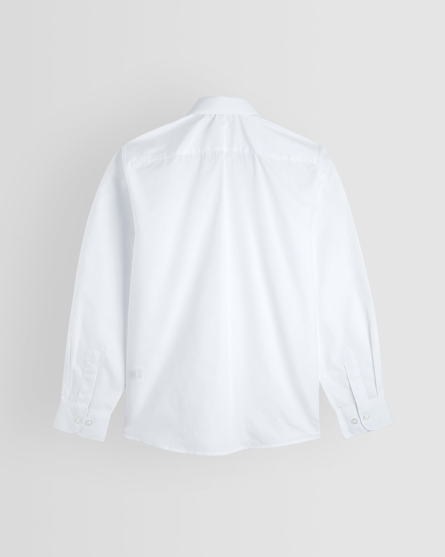 Back of white blouse on grey background