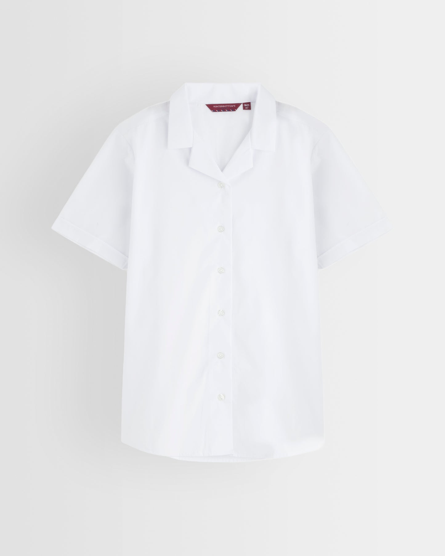 Single white revere collar short-sleeve blouse on a light grey background