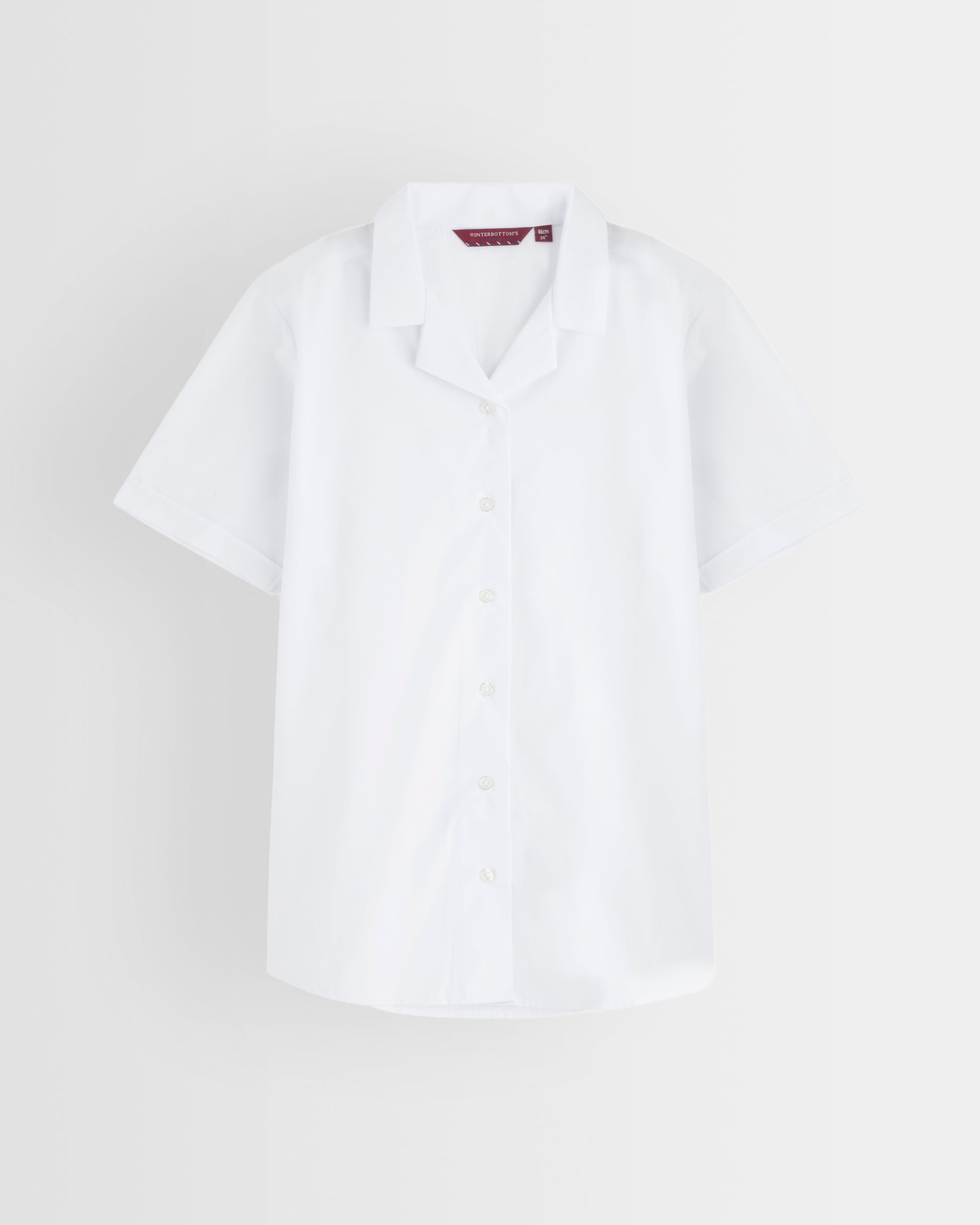 Single white revere collar short-sleeve blouse on a light grey background