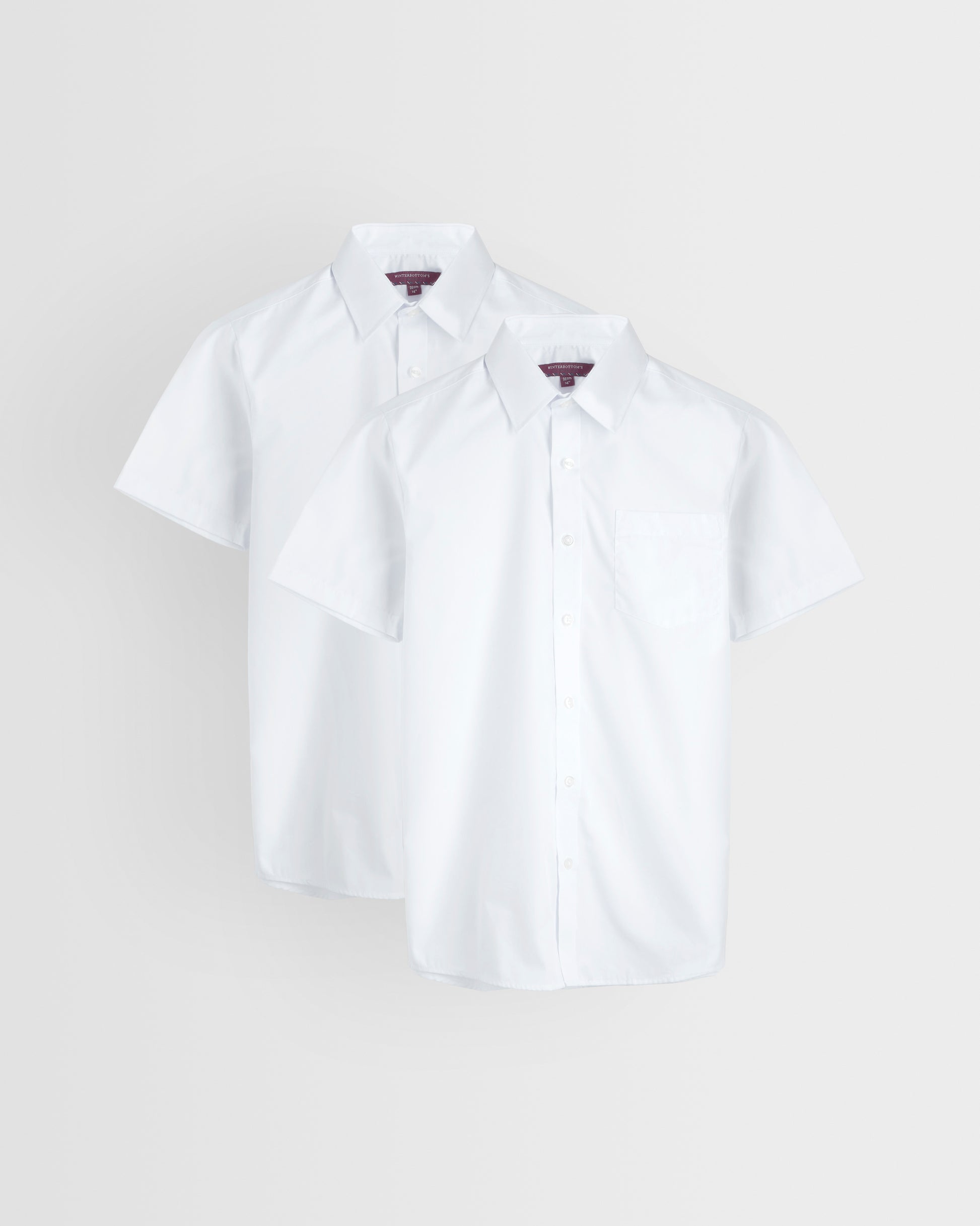 Two short-sleeved white shirts laid out flat on a white background, showcasing the collar and button-up front.