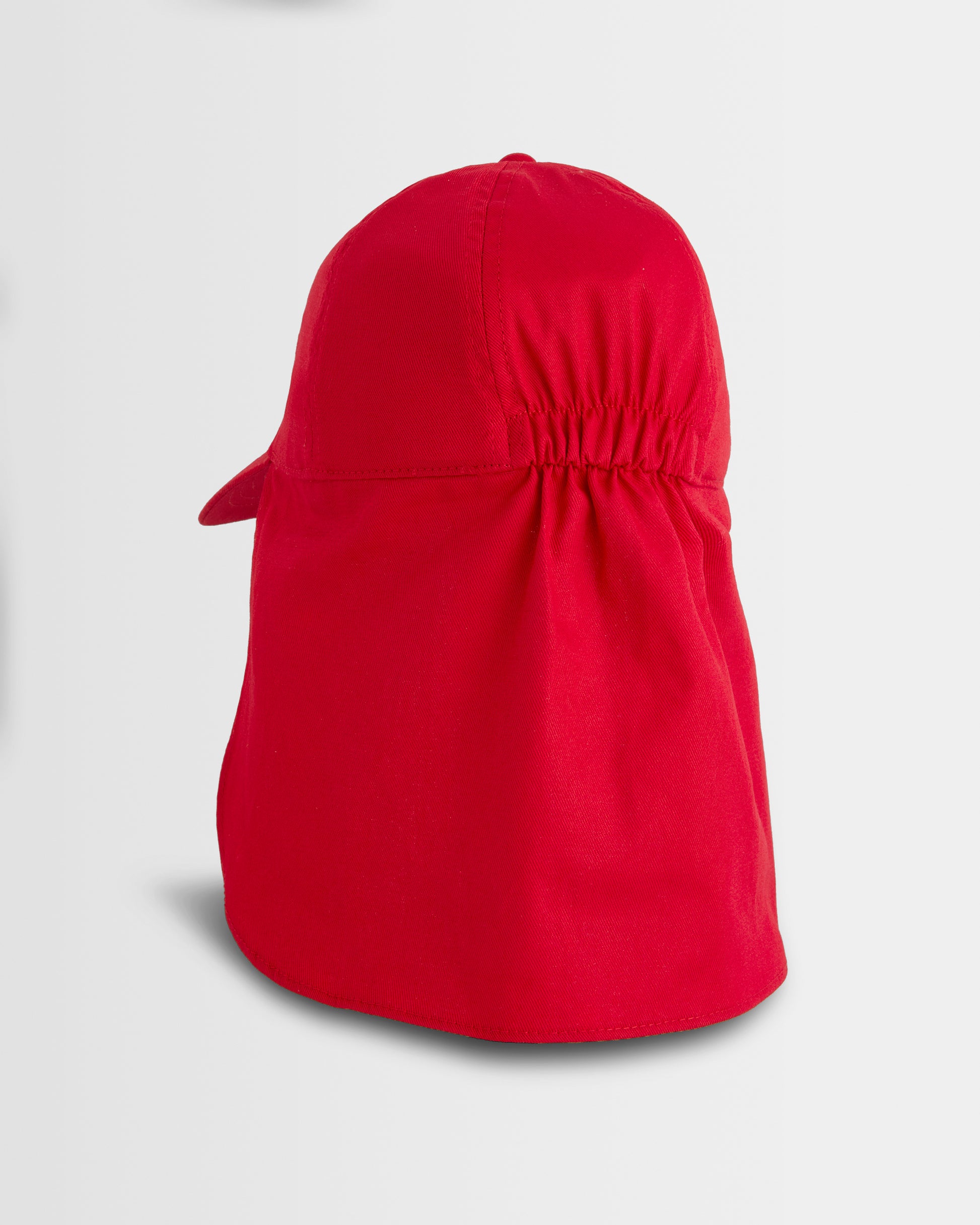 Red sun hat with a flap on a light grey background