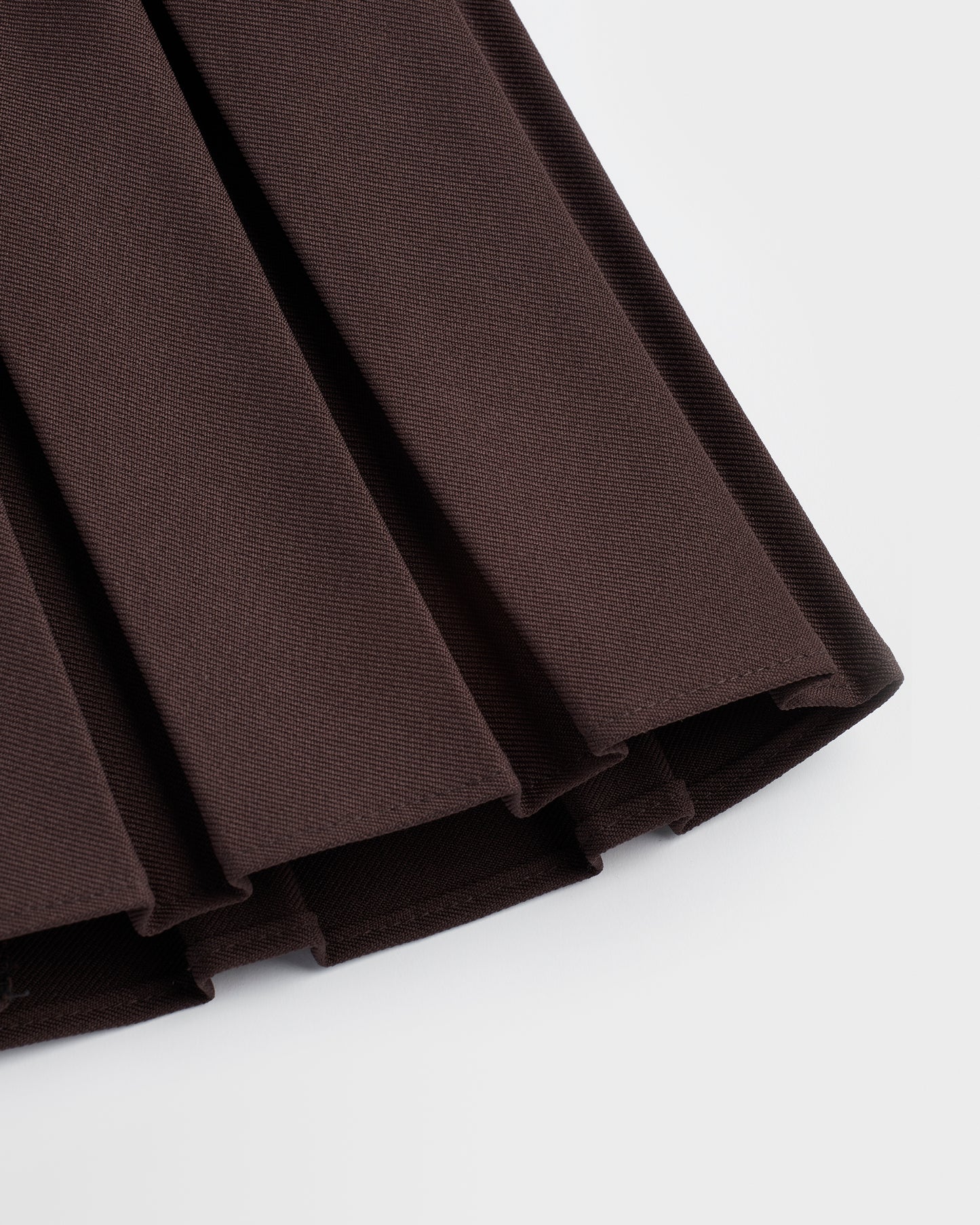 A closeup of the box pleat displayed against a plain background.