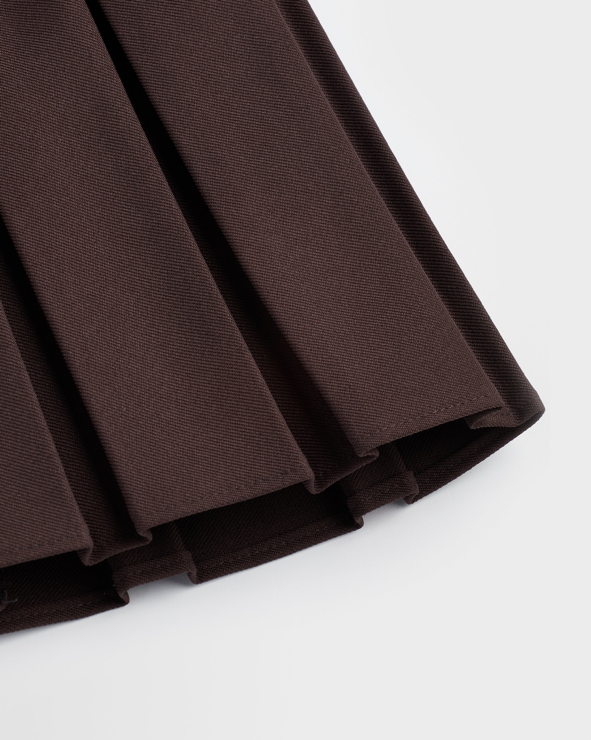 A closeup of the box pleat displayed against a plain background.