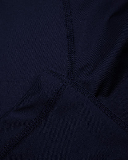 Close up of navy base leggings cuff and seams