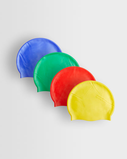 A set of four swim caps in different colors, blue, green, red, and yellow, arranged in a line.