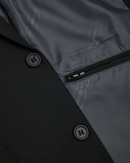 Boys black blazer showing inside zipped pocket and two black external buttons