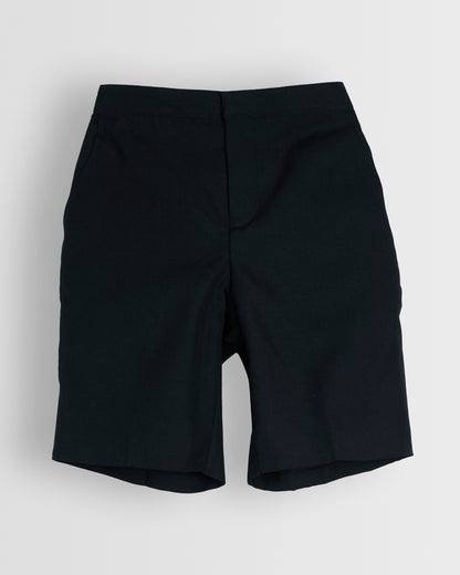 A pair of boys navy summer shorts with a half elasticated waist and single hook and bar fastening, waist size in inches, fully lined, no belt loops.
