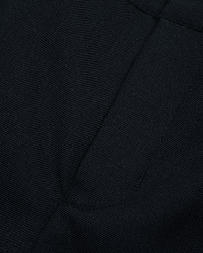 Close up view of boys navy summer shorts single hook and bar fastening