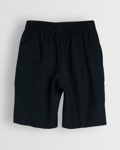 Back view of boys navy summer shorts with a half elasticated waist and single hook and bar fastening, waist size in inches, fully lined, no belt loops.
