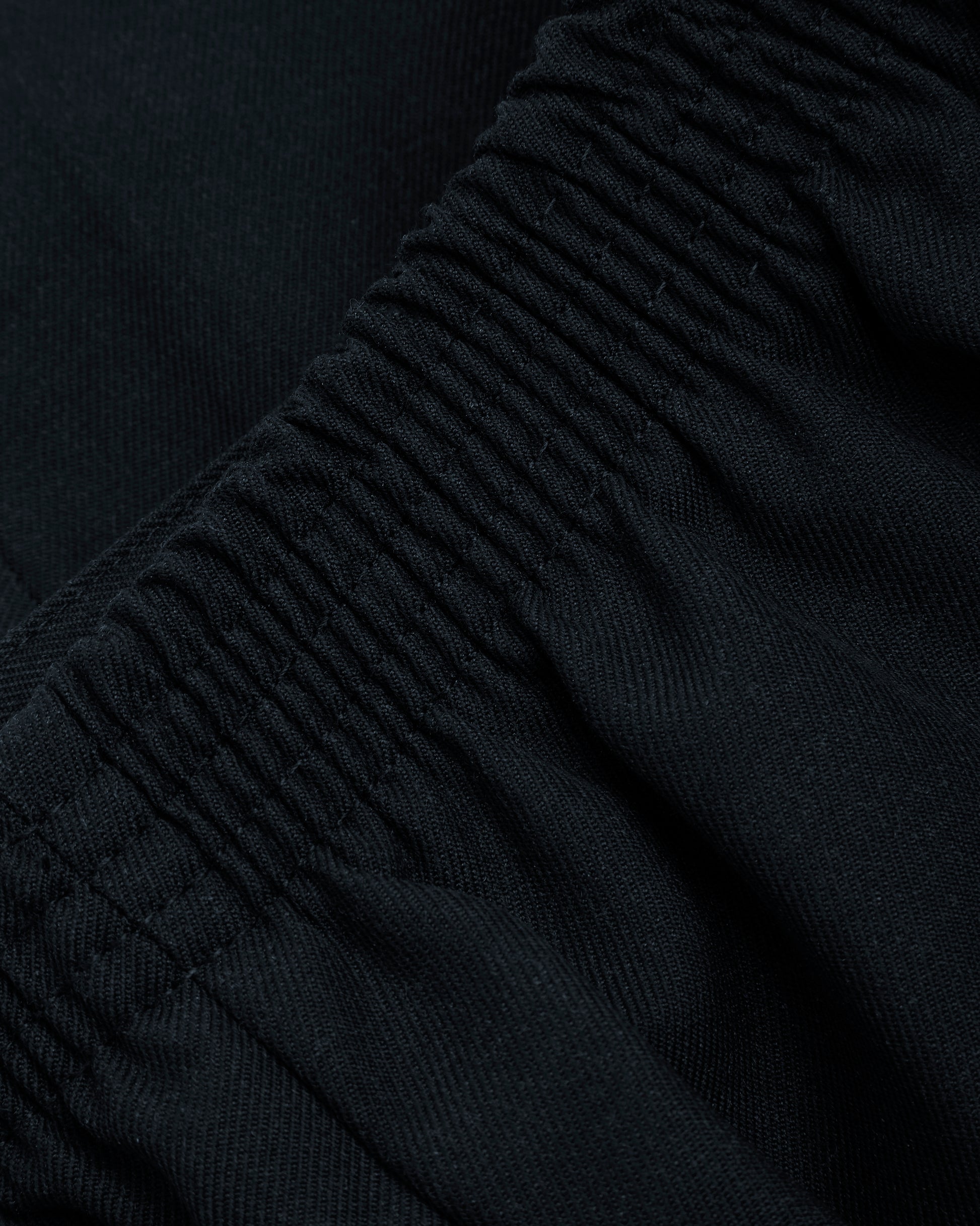 Close up of waitsband eclastic of boys navy summer shorts