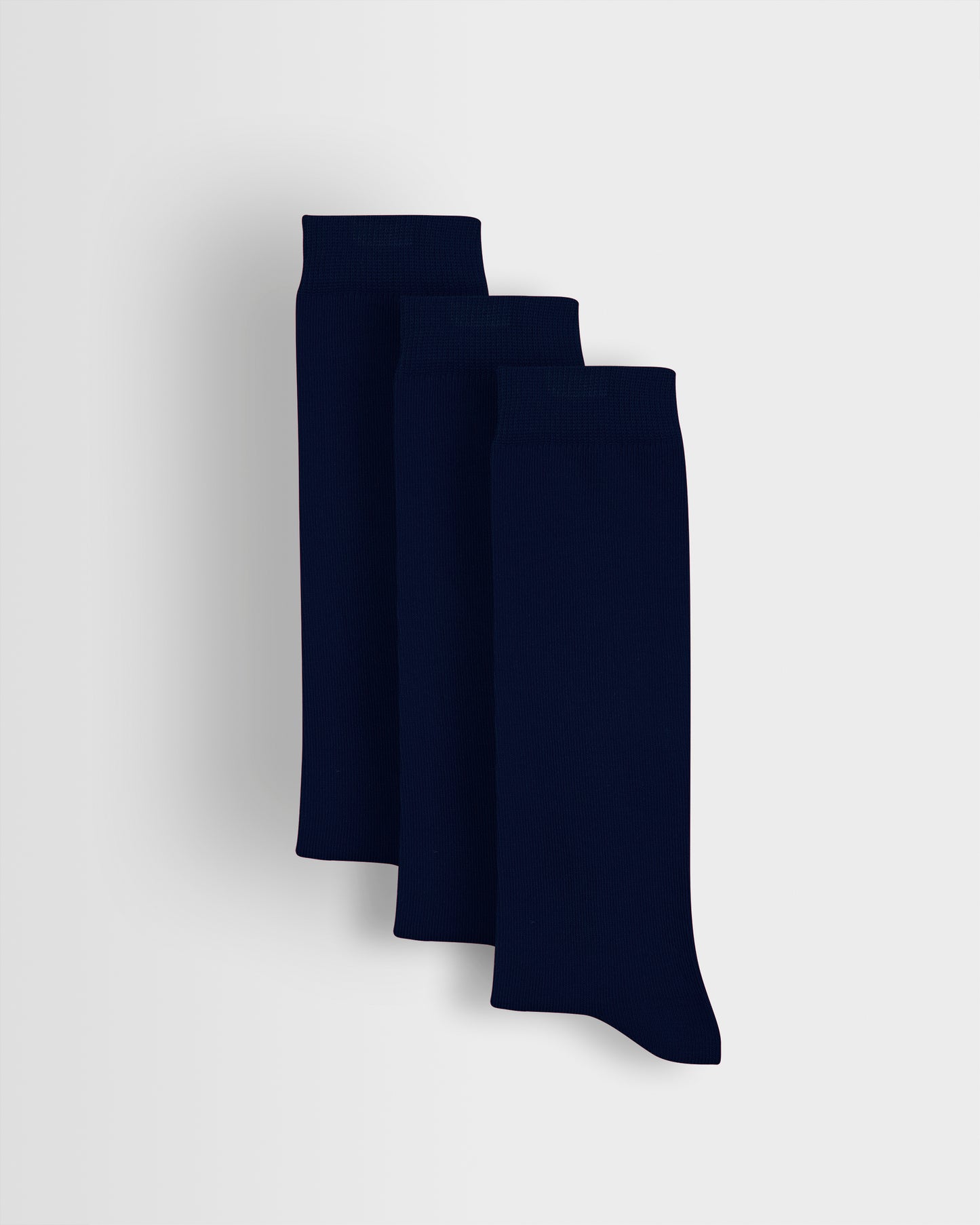 A pack of three navy long socks displayed upright on a plain background.