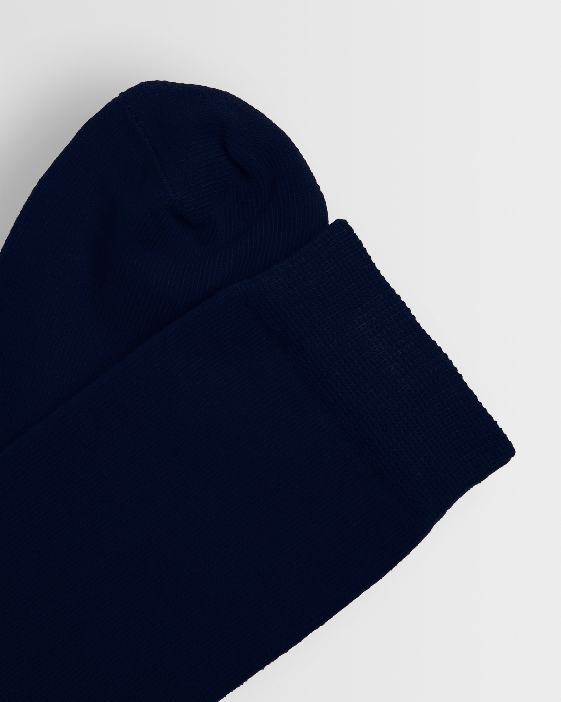 Close up of the toe and top of navy long socks 
