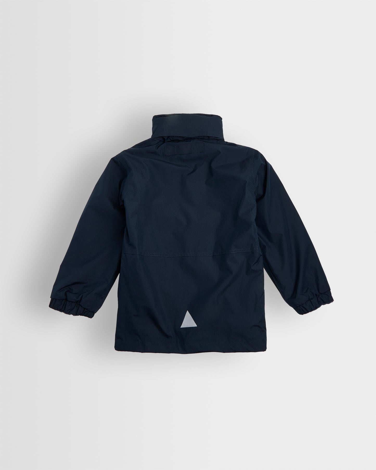 Back view of A navy-colored, long-sleeved waterproof coat with a hood, full-length zip, and studded storm flap. It includes two front zip pockets, an elasticated cuff, and a reflective triangle on the back and front left pocket.