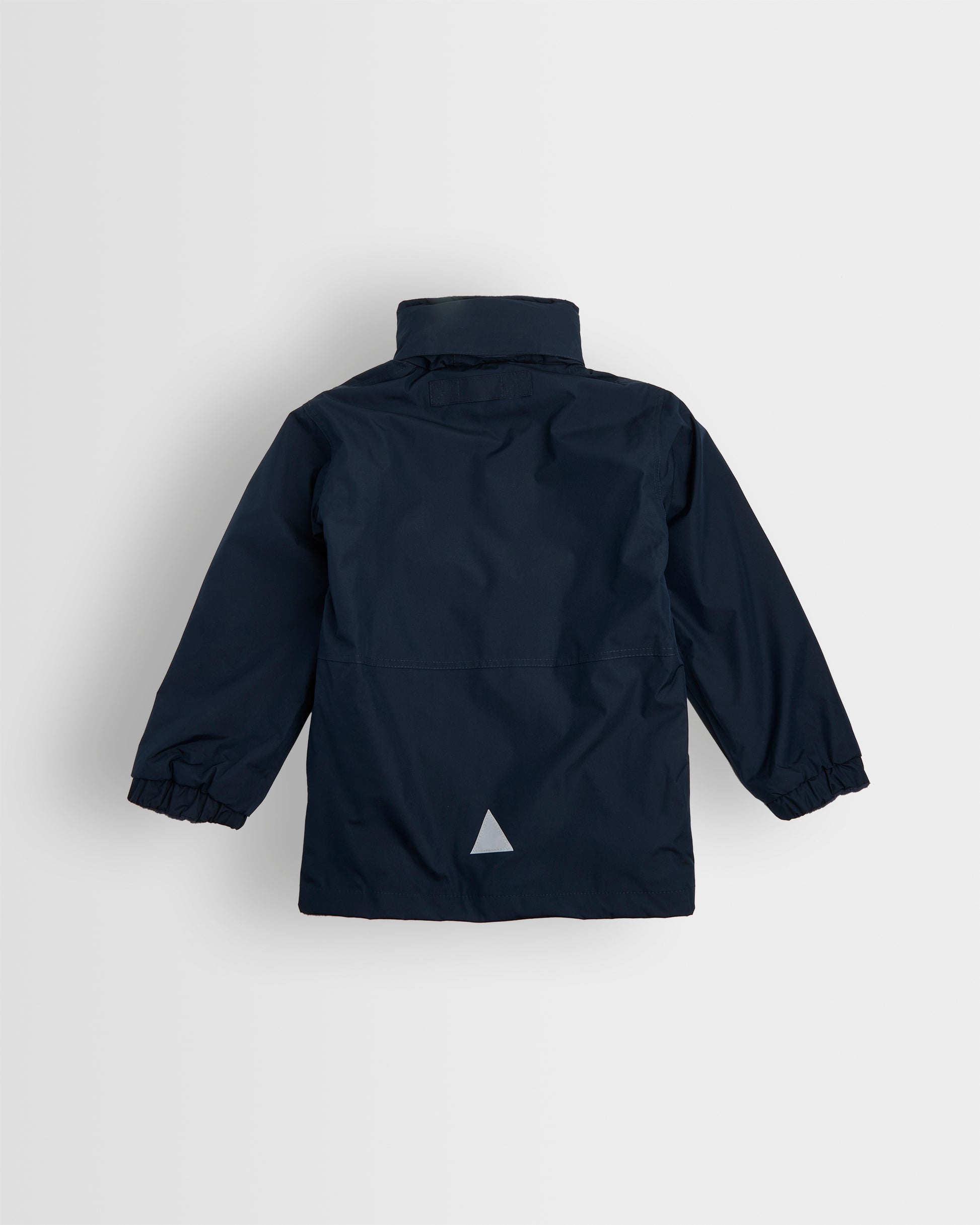 Back view of A navy-colored, long-sleeved waterproof coat with a hood, full-length zip, and studded storm flap. It includes two front zip pockets, an elasticated cuff, and a reflective triangle on the back and front left pocket.