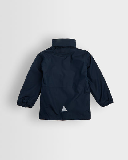 Back view of A navy-colored, long-sleeved waterproof coat with a hood, full-length zip, and studded storm flap. It includes two front zip pockets, an elasticated cuff, and a reflective triangle on the back and front left pocket.