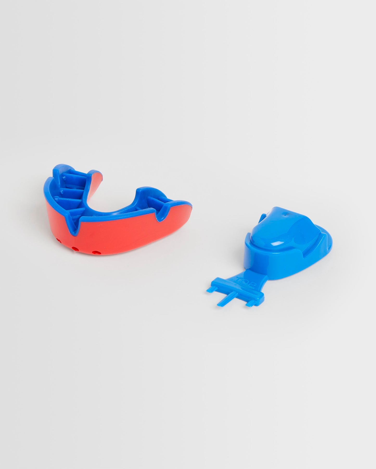 A red/blue OPRO mouthguard and its packaging on a white background.
