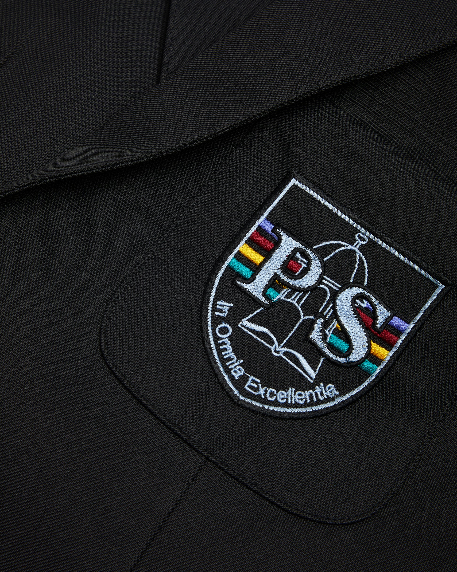 Black Blazer close up of Perins Logo on chest pocket