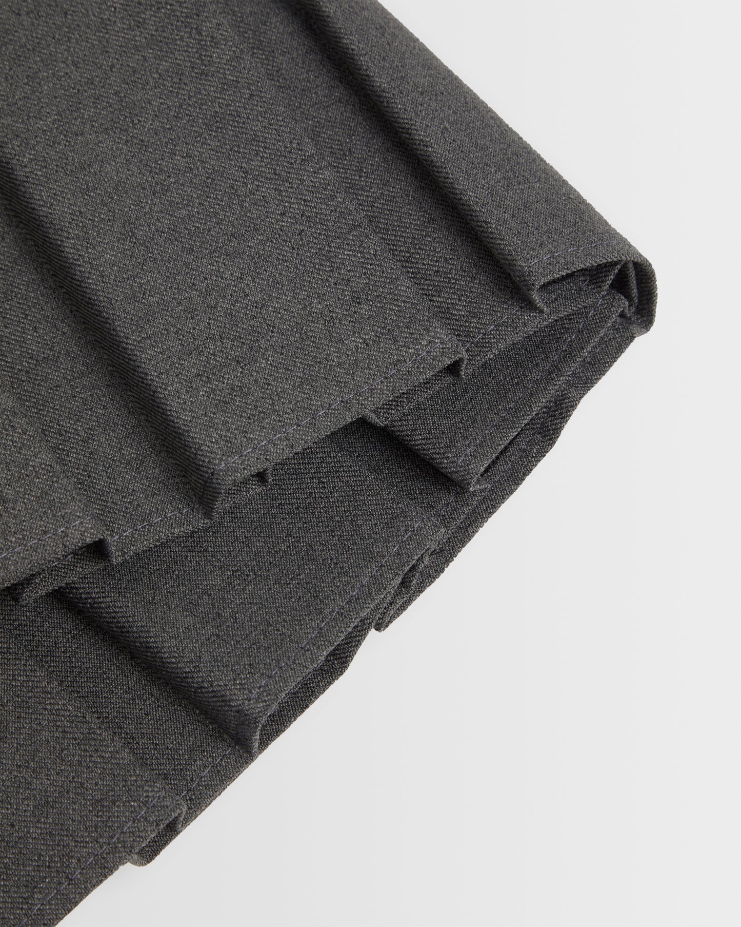 A closeup of the box pleat displayed against a plain background.