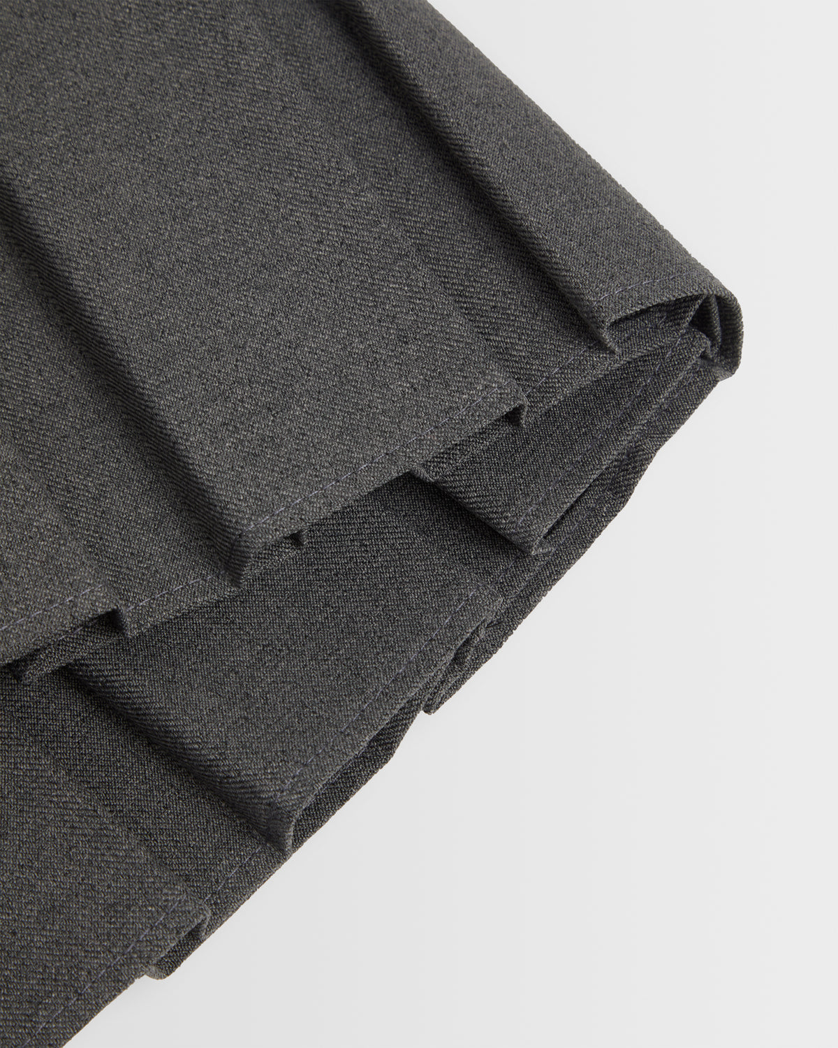 A closeup of the box pleat displayed against a plain background.