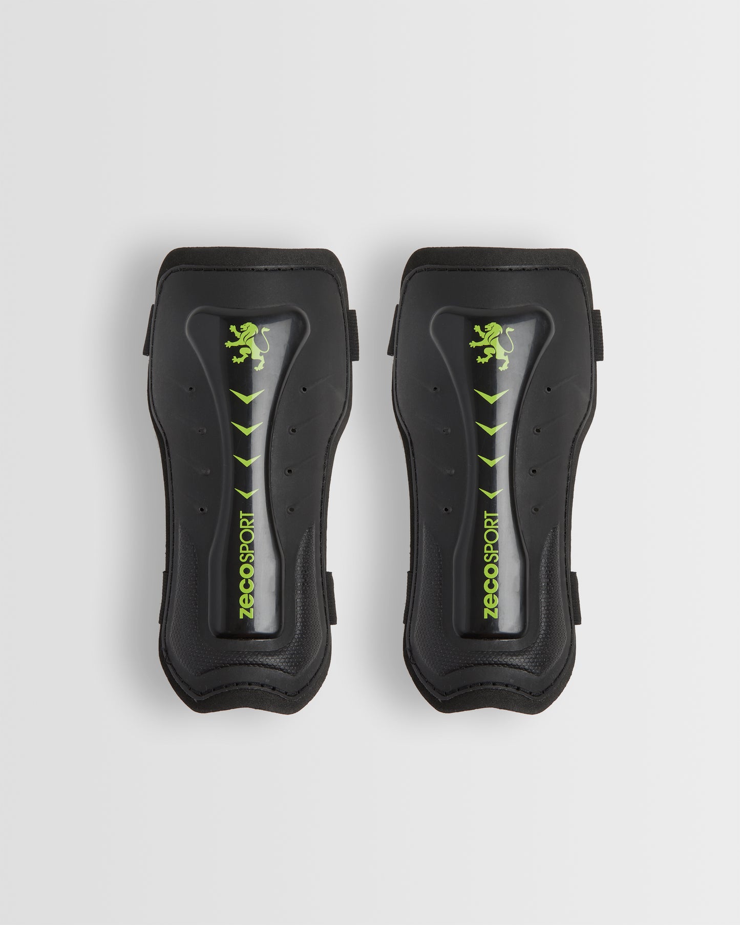 A pair of black shin guards with a visible logo in green.