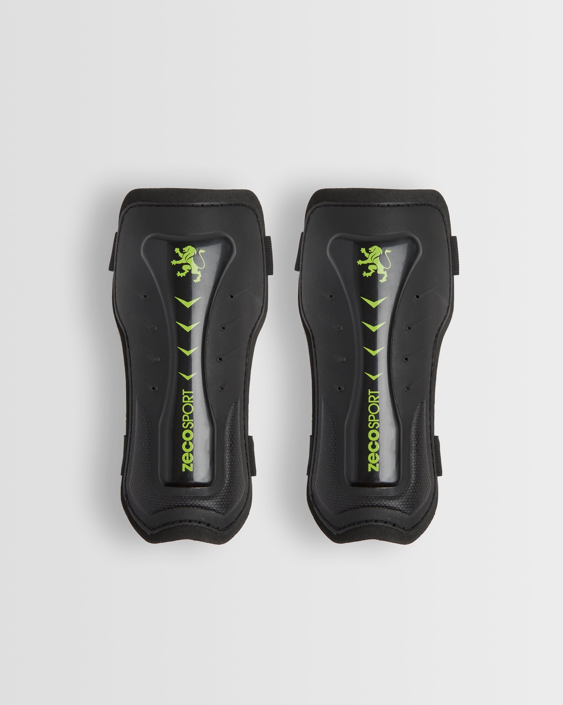 A pair of black shin guards with a visible logo in green.